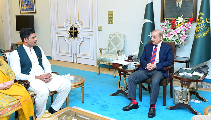 Pakistan’s ace javelin thrower Arshad Nadeem calls on Prime Minister Shehbaz Sharif (right) on March 19, 2024. — PID