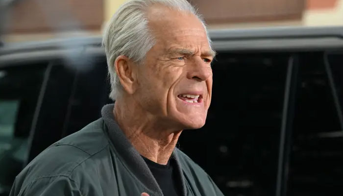 Former White House adviser Peter Navarro talking to the media before going to prison on March 19, 2024. — AFP