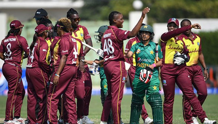 Players of West Indies and Pakistani womens teams interact during a match. — Windiescricket website/File