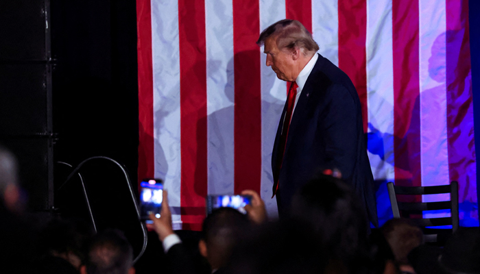 Republican presidential candidate and former president Donald Trump walks at the Black Conservative Federation gala dinner, in Columbia, South Carolina, on February 23, 2024. Donald Trump is said to be broke and far behind Joe Biden in finances. — Reuters