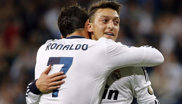 Mesut Ozil (right) with Cristiano Ronaldo.  — Facebook/Mesut Özil/File