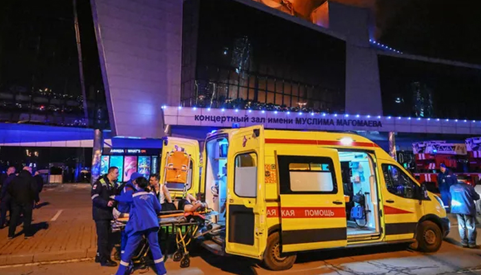 This image taken from the Russian news agency shows medical services representatives responding to a deadly shooting and explosions in Moscows Crocus City Hall on March 22, 2024. — RIA Novosti