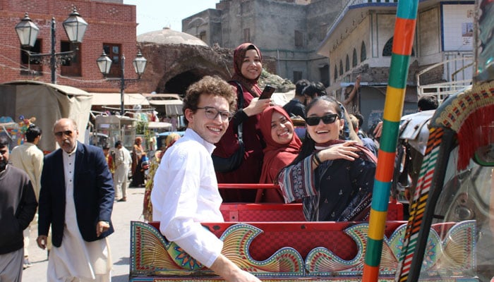 Harvard students pose for a photo during visit to a Pakistani city. — Courtesy: Simon J. Levien
