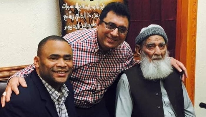 Late Abdul Latif Khanzada (right) is accompanied by Congressman Mark Veasy (left) from Texas on the occasion of his visit to the local mosque, while his son Raja Zahid Khanzada is in the middle. — Supplied