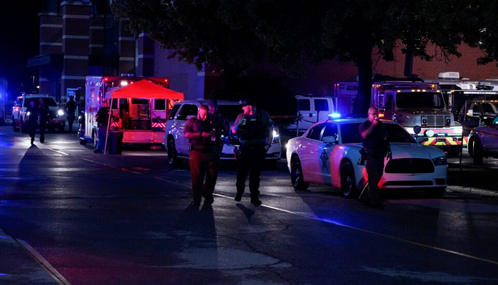 Law enforcement officers walk near the crime scene after a shooting at a mall in the Indianapolis suburb of Greenwood, Indiana. — Reuters/File