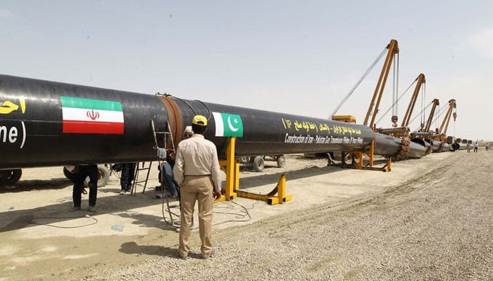 Workers and supervisors are seen at the site of the gas pipeline between Pakistan and Iran. — AFP/File