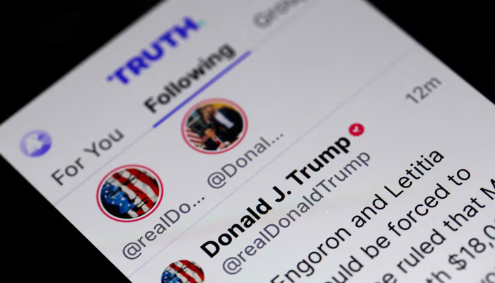 Former US president Donald Trumps social media platform Truth social shows his profile. Donald Trumps company goes public Tuesday. — AFP/File