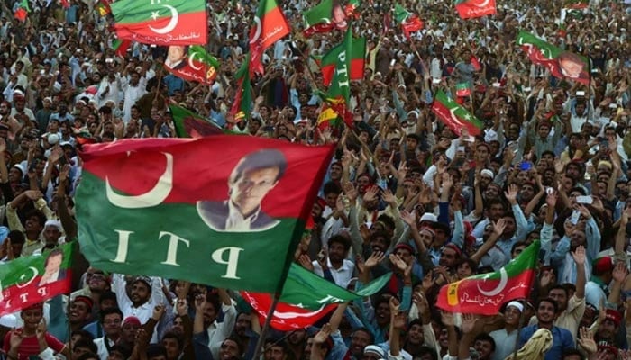 PTI supporters attend a party rally in Charsadda. — AFP/File