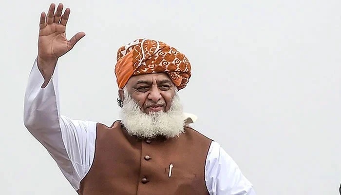 JUI-F chief Maulana Fazlur Rehman waves to a crowd at a rally. — AFP/File