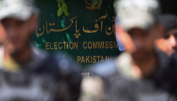 Paramilitary soldiers stand guard outside the election commission building in Islamabad on August 2, 2022. — AFP