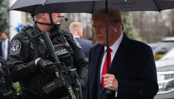 Former president Donald Trump walks after attending a wake for New York City Police Department officer in Massapequa Park, New York on March 28, 2024. Joe Biden raises record $26 million for his campaign. — Reuters