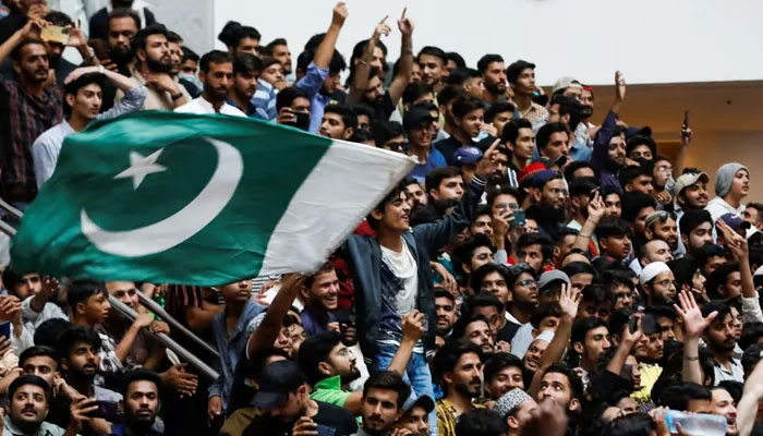Pakistani cricket fans watch the T20 World Cup final, held in Australia, on a big screen in Karachi on November 13, 2023. — Reuters