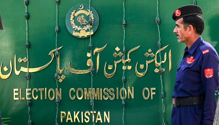 A security person stands guard at the headquarters of the Election Commission of Pakistan (ECP) in Islamabad. — AFP/File