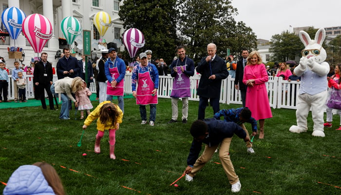 President Joe Biden blows a whistle during the annual Easter Egg Roll on the South Lawn of the White House, Washington on April 1, 2024. — Reuters