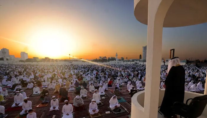 Muslim worshippers listen to the Eid al-Fitr morning prayer sermon at Dubais Eid Musalla in the Gulf emirates old port area on May 13, 2021, as Muslims across the golbe mark the end of the holy fasting month of Ramadan. — AFP