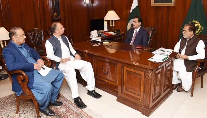 Leader of the Opposition in National Assembly Omar Ayub (second left) and NA Speaker Ayaz Sadiq (second right) are discussing nomination of opposition leader at the speakers office in Islamabad on April 2, 2024. —X/@NAofPakistan