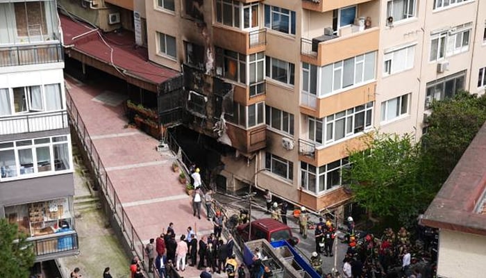 This image shows emergency officials at a scene amid a fire in Istanbul on April 2, 2024. At least 16 people were killed in a nightclub fire in Istanbul. — Anadolu Agency