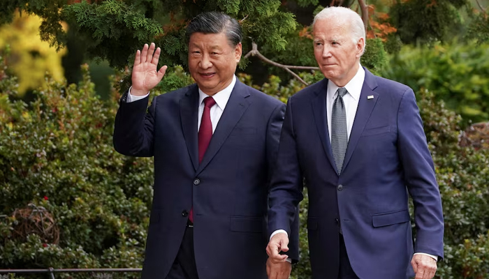 Chinese President Xi Jinping waves as he walks with US President Joe Biden at Filoli estate on the sidelines of the Asia-Pacific Economic Cooperation (APEC) summit, in Woodside, California, US, November 15, 2023. — Reuters