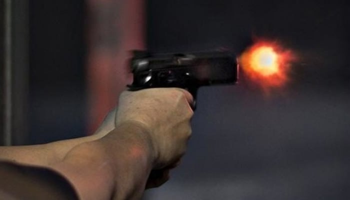 Representation image of man shooting a pistol. — Reuters