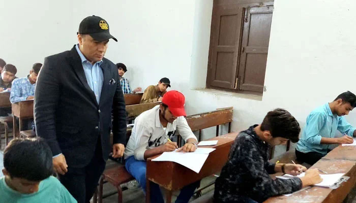 In this image, Commissioner/Chairman Lahore Board Muhammad Ali Randhawa pays surprise visits to examination centre during the Secondary School Certificate (Class 9th) Annual 2024 on April 2, 2024. — Facebook/Commissioner Lahore,Punjab.