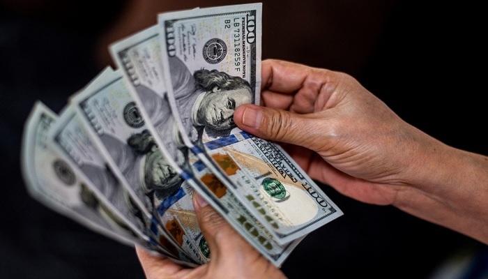 A person shows U.S. dollars at a currency exchange store in Manila, Philippines, October 21, 2022.— Reuters