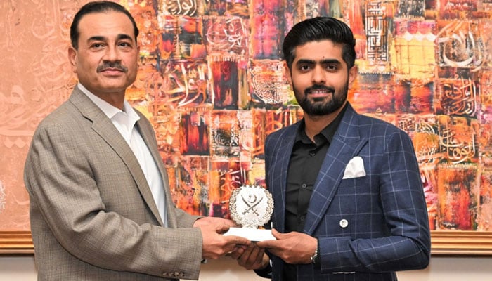 Pakistans white-ball captain Babar Azam (right) with Chief of Army Staff (COAS) General Syed Asim Munir. — ISPR