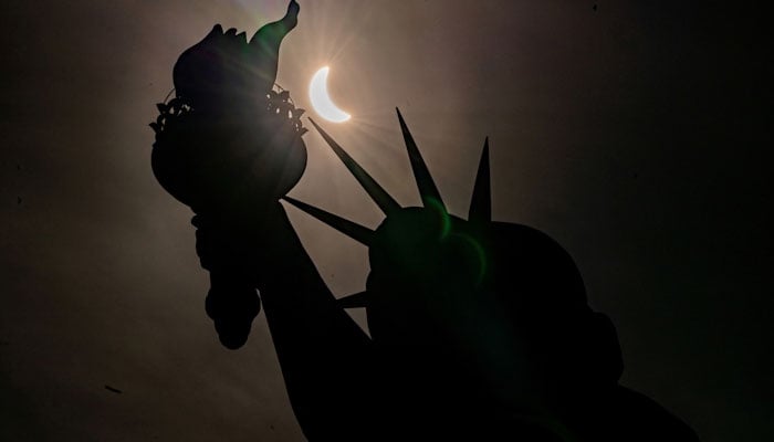 Statue of Liberty is seen during a partial solar eclipse at Liberty Island in New York City, April 8, REUTERS