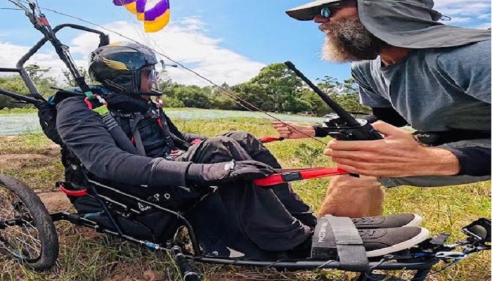 Ajmal Samuel, a Hong Kong-based special athlete of Pakistani origin, takes instructions from his paragliding trainer Matthew Van Zyl. — Supplied