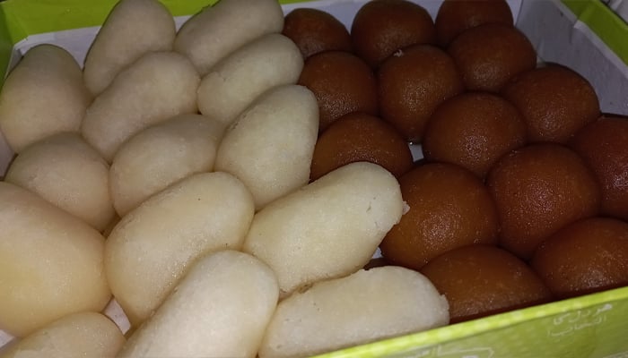 Photo: A box of popular Pakistani mithayi, Chum chum (left) and Gulab Jamun (right)