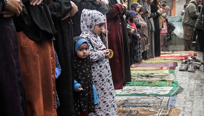 Palestinians attend Eid al-Fitr prayers during rain in northern Gaza Strip, April 10, 2024. — Reuters