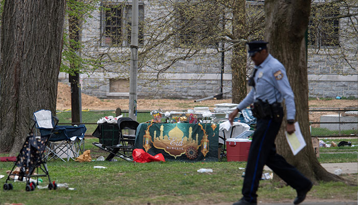 A police officer patrols the area of a shooting that took place during an Eid event being held at Clara Muhammad Square in West Philadelphia, Pennsylvania, US on April 10, 2024. — Reuters