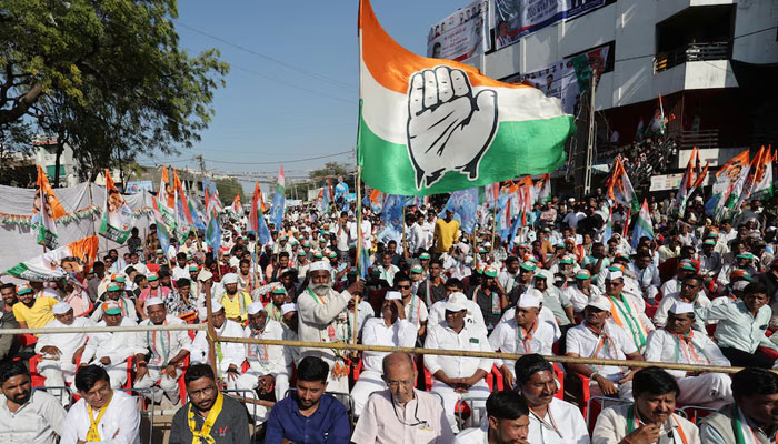 A supporter of Rahul Gandhi, a senior leader of Indias main opposition Congress party, waves a party flag in a public meeting during Rahuls 66-day long Bharat Jodo Nyay Yatra, or Unite India Justice March, in Jhalod town, Gujarat state, India, March 7, 2024. — Reuters