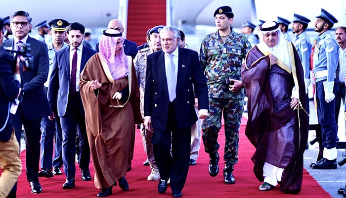 Saudi FM Prince Faisal bin Farhan bin Abdullah (centre-left) walking along with FM Ishaq Dar (centre-right) after landing in Islamabad on two-day official visit on April 15, 2024. — X/@ForeignOfficePk