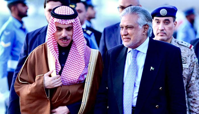 Saudi Arabian FM Prince Faisal Bin Farhan Al Saud (left) speaks with Foreign Minister Ishaq Dar following his arrival at the Nur Khan Airbase Rawalpindi on April 15, 2024. — X/ForeignOfficePk