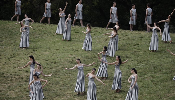 Performers dance during the Olympic Flame lighting ceremony for the Paris 2024 Olympics. — Reuters