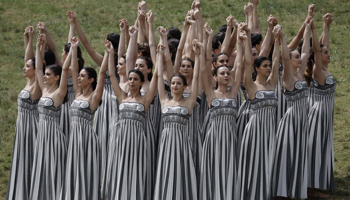 Performers dance during the Olympic Flame lighting ceremony for the Paris 2024 Olympics. — Reuters