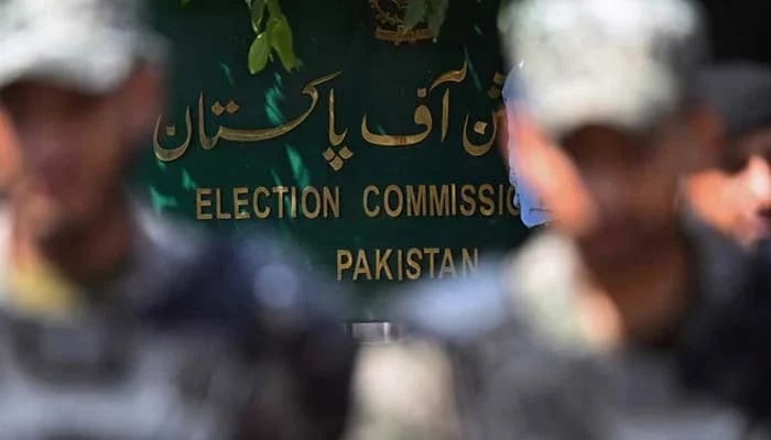 Paramilitary soldiers stand guard outside Pakistan’s election commission building in Islamabad on August 2. — AFP