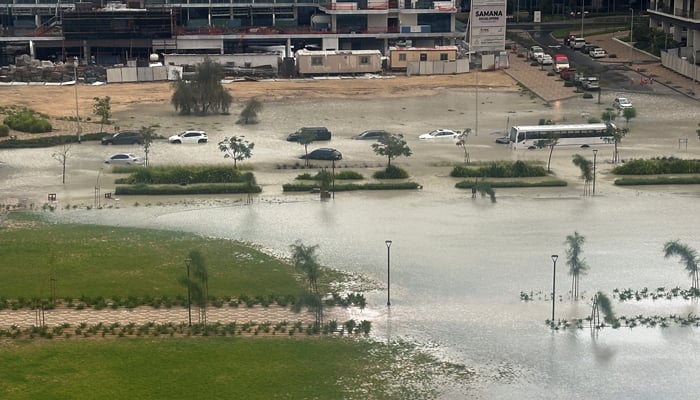 Cars drive through a flooded street during a rain storm in Dubai, United Arab Emirates, April 16, 2024. — Reuters