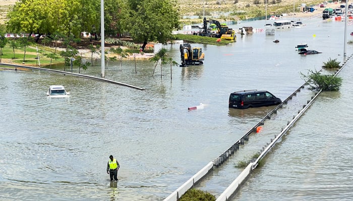 Vehicles are stuck on a flooded road after a rainstorm in Dubai, UAE on April 17, 2024. — Reuters