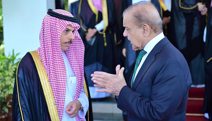 Prime Minister Shehbaz Sharif talking to Saudi Foreign Minister Prince Faisal bin Farhan during his two-day official visit on April 17, 2024. — APP