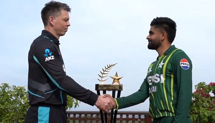 New Zealand skipper Michael Bracewell (left) and Pakistans captain Babar Azam shake hands with the series trophy pictured in the background. — Screengrab/YouTube/Pakistan Cricket