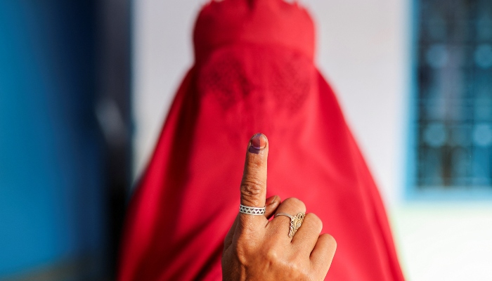A woman clad in a burqa shows her ink-marked finger after voting at a polling station during the first phase of the general election in Kairana, in the northern Indian state of Uttar Pradesh, India, on April 19, 2024. —Reuters