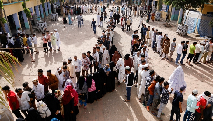 Voters line up outside a polling station to vote during the first phase of the general election in Kairana, in the northern Indian state of Uttar Pradesh on April 19, 2024. —Reuters