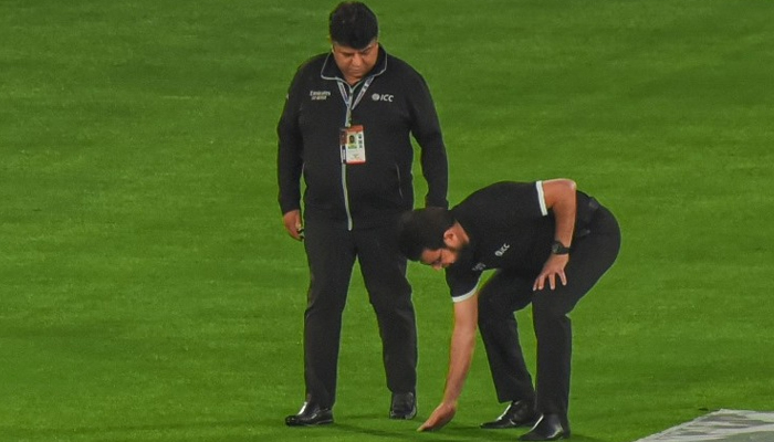 Umpires inspect the field on Thursday in Rawalpindi. - PCB