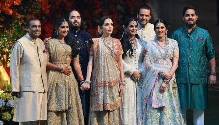 The Ambani family (from left to right) Mukesh, Radhika Merchant, Anant, Nita, Isha, Anand Piramal, Shloka Mehta, and Akash. — AFP/File