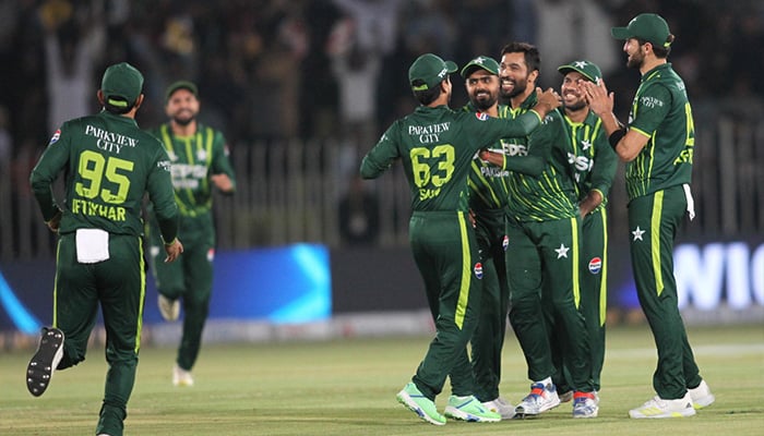 Pakistani players celebrate together after taking a wicket during second T20I at Pindi Cricket Stadium on April 20, 2024. — PCB