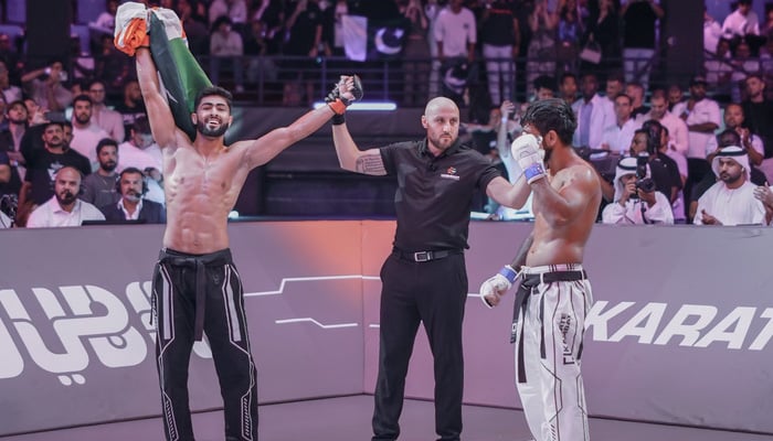 Pakistans Shahzaib Rindh celebrates after winning the match against India at Karate Combat 45 event in Dubai on April 20. 2024. — X/@KarateCombat