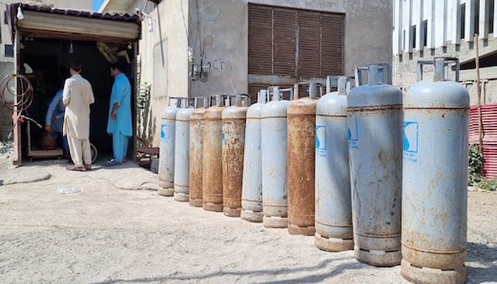 Gas cylinders are seen lined up outside a shop in Karachi. — Zofeen Ebrahim/IPS