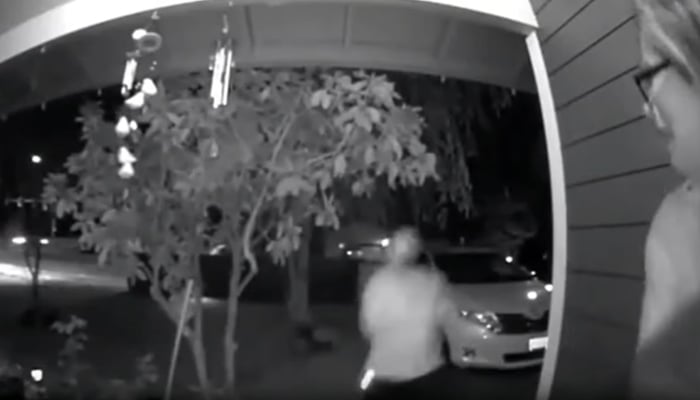 The bearded man takes her away into his car in this still taken from a video. — KGW8