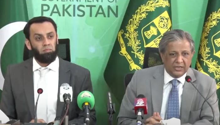 Federal Law Minister Azam Nazeer Tarar (right) and Federal Information Minister Attaullah Tarar address the press conference in Islamabad on April 23, 2024 in this still taken from a video. — Geo News